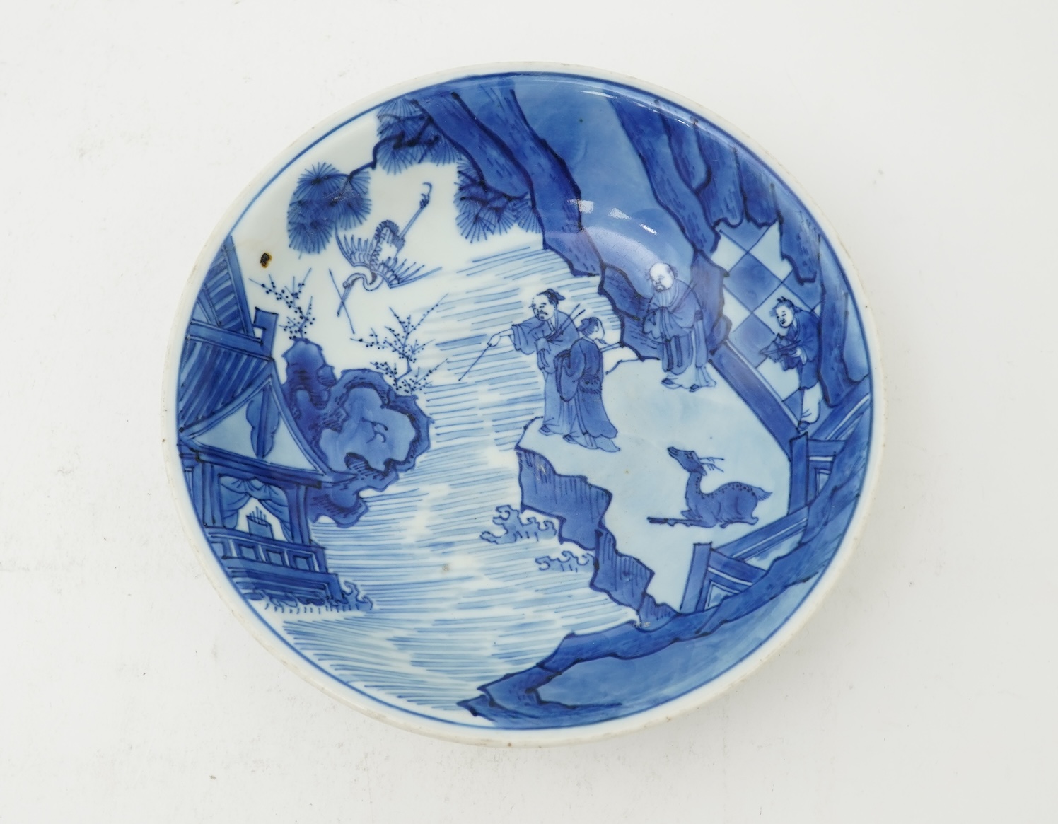A Chinese blue and white saucer dish, Kangxi six character mark and of the period (1662-1722)